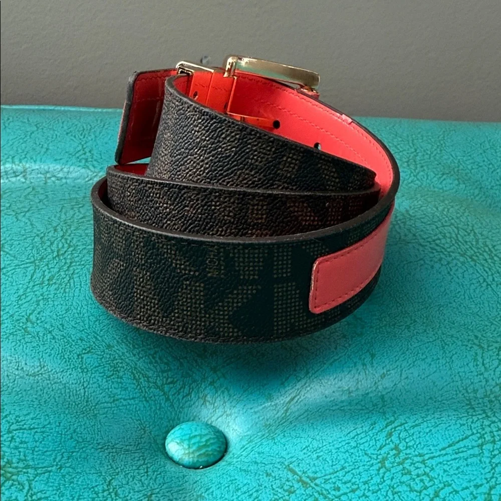 Reversible Michael Kors MK logo belt with bright shiny coral side - see flaw